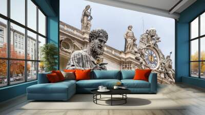 Statue of St Peter outside St Peter's basilica in Vatican City with Clock Tower on background Wall mural