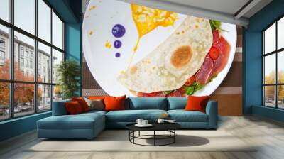 Delicious tortilla with jamon ham meat and fresh vegetables Wall mural