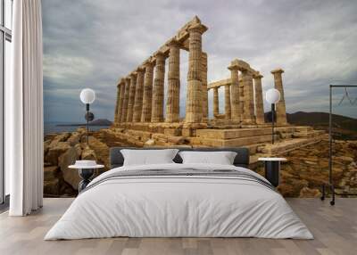 The ancient ruin of Poseidon, Cape of Sounion with cloudy weather near Athens, Greece. Wall mural