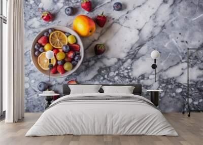 Gray marble surface with a few pieces of fruit, top view Wall mural