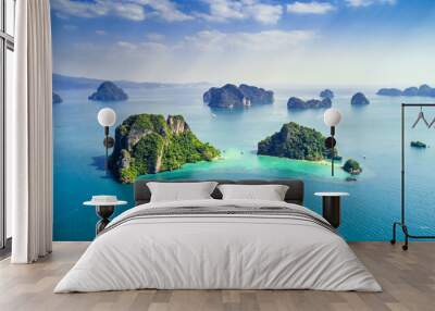 Surrounding Islands of Koh Yao Noi, Phuket, Thailand green lush tropical island in a blue and turquoise sea with islands in the background and clouds with sun beams shining through, drone aerial photo Wall mural