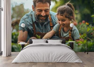 little daughter helping father to plant,water flowers home gardening concept Wall mural