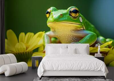 a frog sitting on a yellow flower with a green background Wall mural