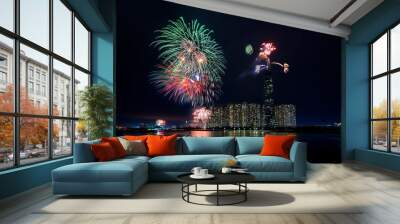 Fireworks happy new year 2021 light up sky over business district in Ho Chi Minh city view from Landmark 81 riverside. Landmark 81 is the tallest building in Vietnam Wall mural