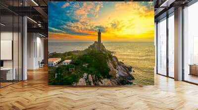 Landscape of small island with ancient lighthouse at sunrise sky is beautiful and peaceful. This is only ancient lighthouse is located on island in Vietnam Wall mural