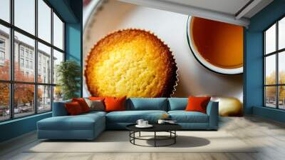 A warm, buttery cornbread muffin with a side of honey butter Wall mural