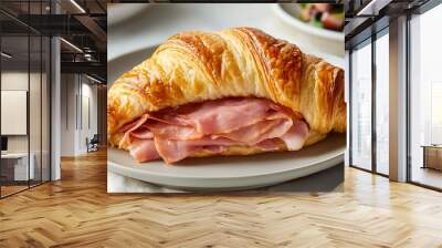 A warm, buttery croissant sandwich filled with ham and Swiss cheese  Wall mural