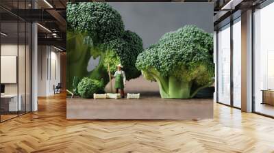 Broccoli and miniature people with business concept. Miniature farmers working and Miniature chefs cooking.
 Wall mural