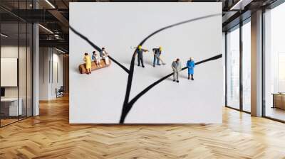 Diverse miniature people. A concept of role conflict. Wall mural