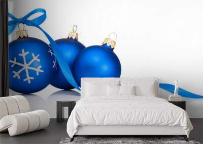 Three blue Christmas decoration bauble with ribbon bow isolated on white background Wall mural