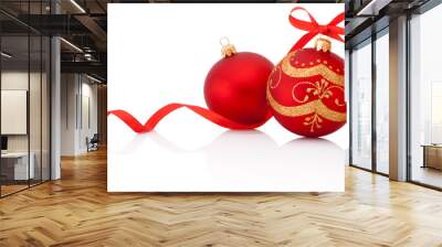 Two Red christmas decoration balls with ribbon bow isolated on w Wall mural