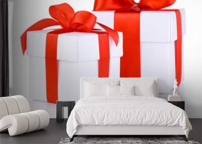 two white boxs tied with a red satin ribbon bow isolated on whit Wall mural