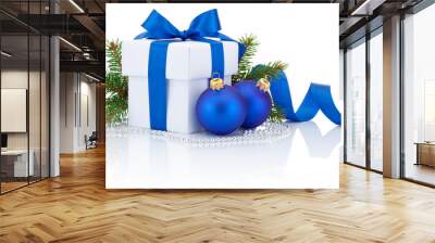 white box tied blue ribbon bow, pine tree branch and two christm Wall mural