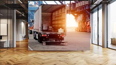 Cargo truck in the port. Heavy-duty commercial vehicle. Semitrailer during loading of the cargo. Modern semi-trailer trucks on the highway. Commercial vehicle for shipping and post delivery. Wall mural