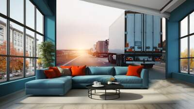 Modern white semi-trailer trucks on the highway driving in the right lane. Commercial vehicle for shipping and post delivery. Shipping of the goods on land with a door-to-door delivery process. Wall mural