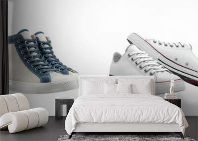 A stylish pair of sneakers isolated on a white background. Wall mural