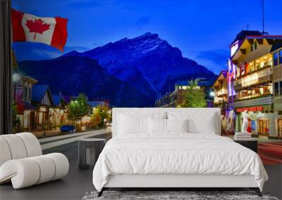 Canadian flag with Banff Avenue at twilight time, Alberta, Canada Wall mural