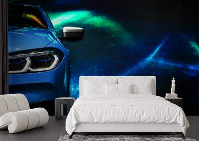 Detail on one of the LED headlights modern car on blue background Wall mural