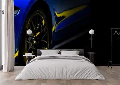 Front headlights of blue modern car on black background, copy space	 Wall mural