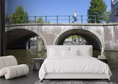 Bridge over the river channel in the center of Amsterdam Wall mural