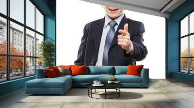 Smiling child boy in business suit index finger pointing directi Wall mural