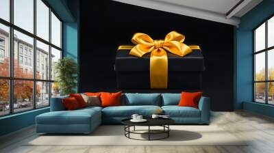 A luxurious gift box, on a solid black background, wrapped in sleek, matte black paper with a textured bow and feathers, creating a romantic luxury atmosphere. For anniversary, birthday presents Wall mural