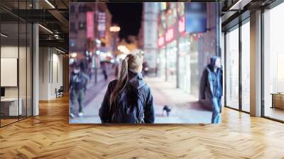 Back view of girl walking on city street at night, Prague Wall mural