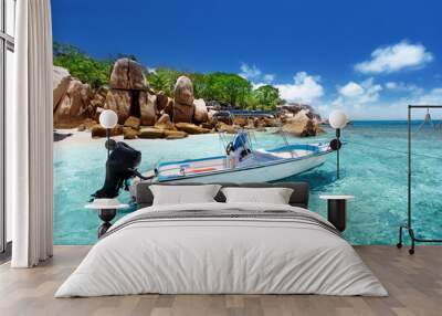 speed boat on the beach of coco island, seychelles Wall mural