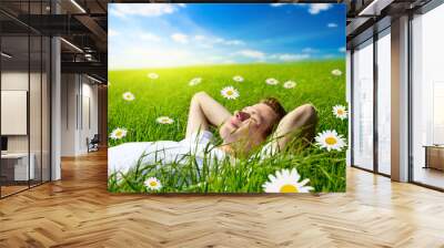 young man in flowers Wall mural