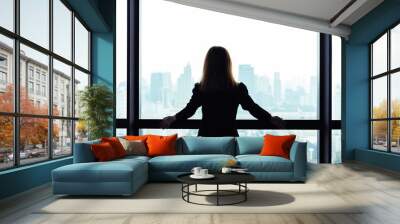 Asian business woman standing and looking out the window at city view background Wall mural