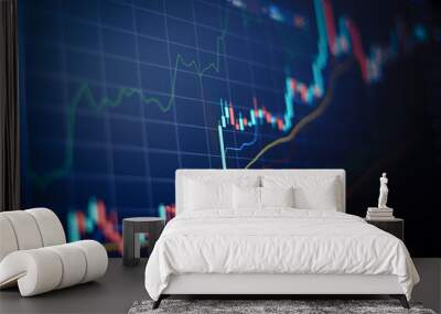 Closeup financial chart with uptrend line candlestick graph in stock market on blue color monitor background Wall mural