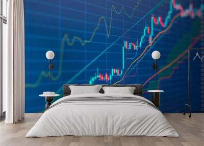 Closeup financial chart with uptrend line candlestick graph in stock market on blue color monitor background Wall mural