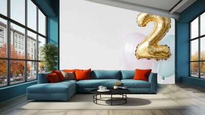 Gold number 2 balloon surrounded by pastel-colored balloons for second birthday celebration, party decoration, or special event with a simple and elegant aesthetic Wall mural