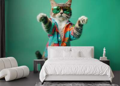 Cat wearing colorful clothes and sunglasses dancing on the green background Wall mural