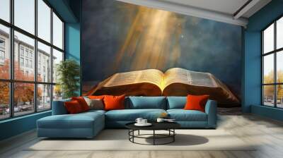 Open bible on a dark background with rays of light and smoke Wall mural