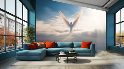 Angel flying in the sky above the clouds Wall mural