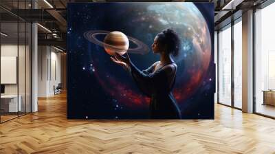 Astrology concept with woman holding planet in outer space Wall mural