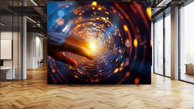 First contact, with hand touching spinning vortex of light particles, neuronal network concept Wall mural