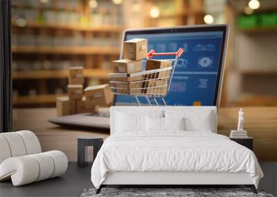 Online shopping concept with cart full of boxes on top of laptop computer Wall mural