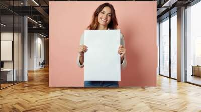 Smiling Woman Holding a Blank White Sign Wall mural