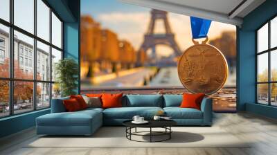 Close up of gold medal with blurry Eiffel tower background. Olympic games concept.	 Wall mural