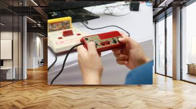 people playing old family computer game Wall mural