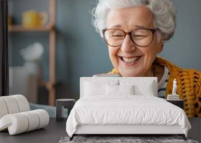 Joyful Senior Embracing Virtual Connection: Elderly Woman Smiling on Video Call, Stay-At-Home Wall mural