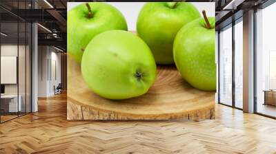 A wooden board with s and greens. Wood table food concept. A wooden board with fruit, s, and greens. A wooden board with lifestyle fruit and greens. Wall mural