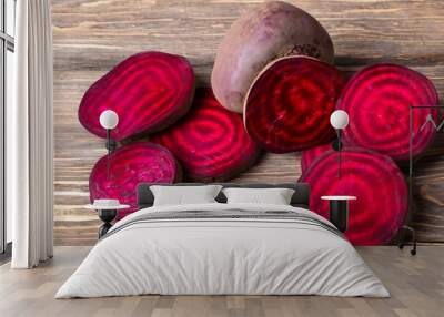 Beets on wooden with vegetables. vegetarian fresh organic concept. a beetroot on a wooden with half of it in red. a beetroot on a wooden with half of it in red lifestyle. Wall mural