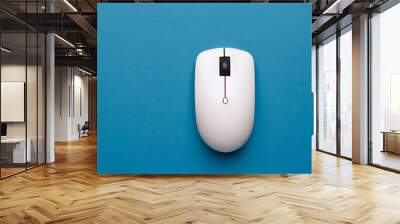 Computer with mouse in blue on . business design hand concept. wireless mouse in blue and white on a white . a computer with a mouse in white and lifestyle blue on a. Wall mural