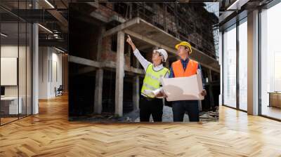 two construction engineer working in construction site and management in the construction site... Wall mural