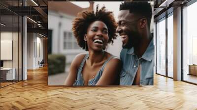 Black couple laughing and talking outdoors - happy relationship concept Wall mural