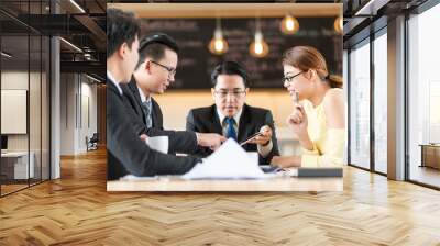 Businesspeople discussing together in conference room during meeting at office Wall mural