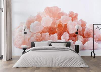 a small pile of himalayan pink salt crystals with a light pink hue against an isolated white background Wall mural